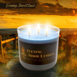 A lit candle with three flames against a sunset background.