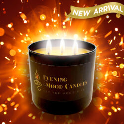 Luxurious lit scented candle in black jar with glowing light.